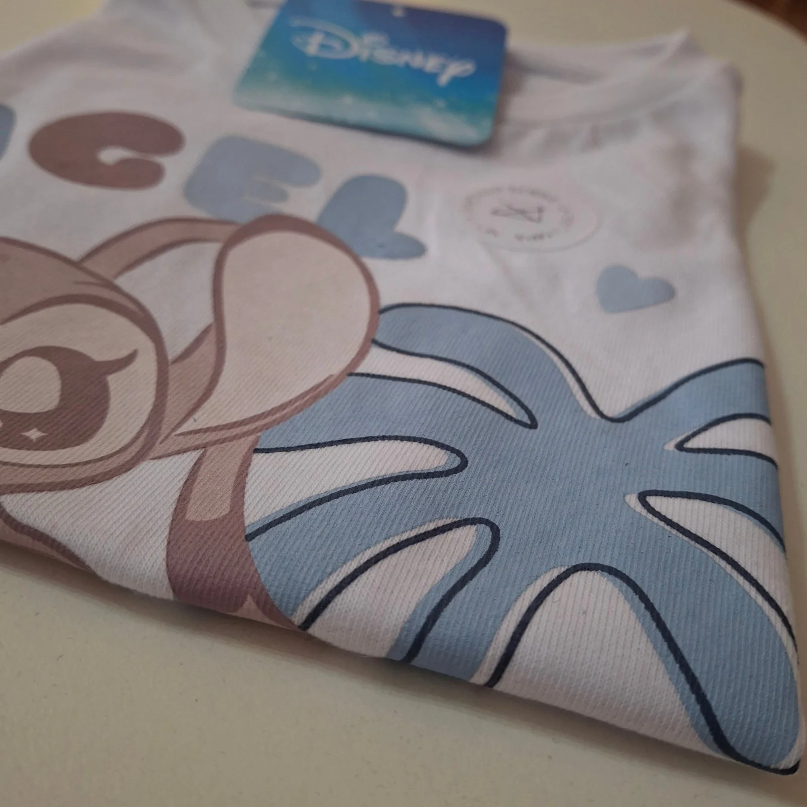 Remera bebé Disney Stitch y Angel blanca volados - Imagen 2