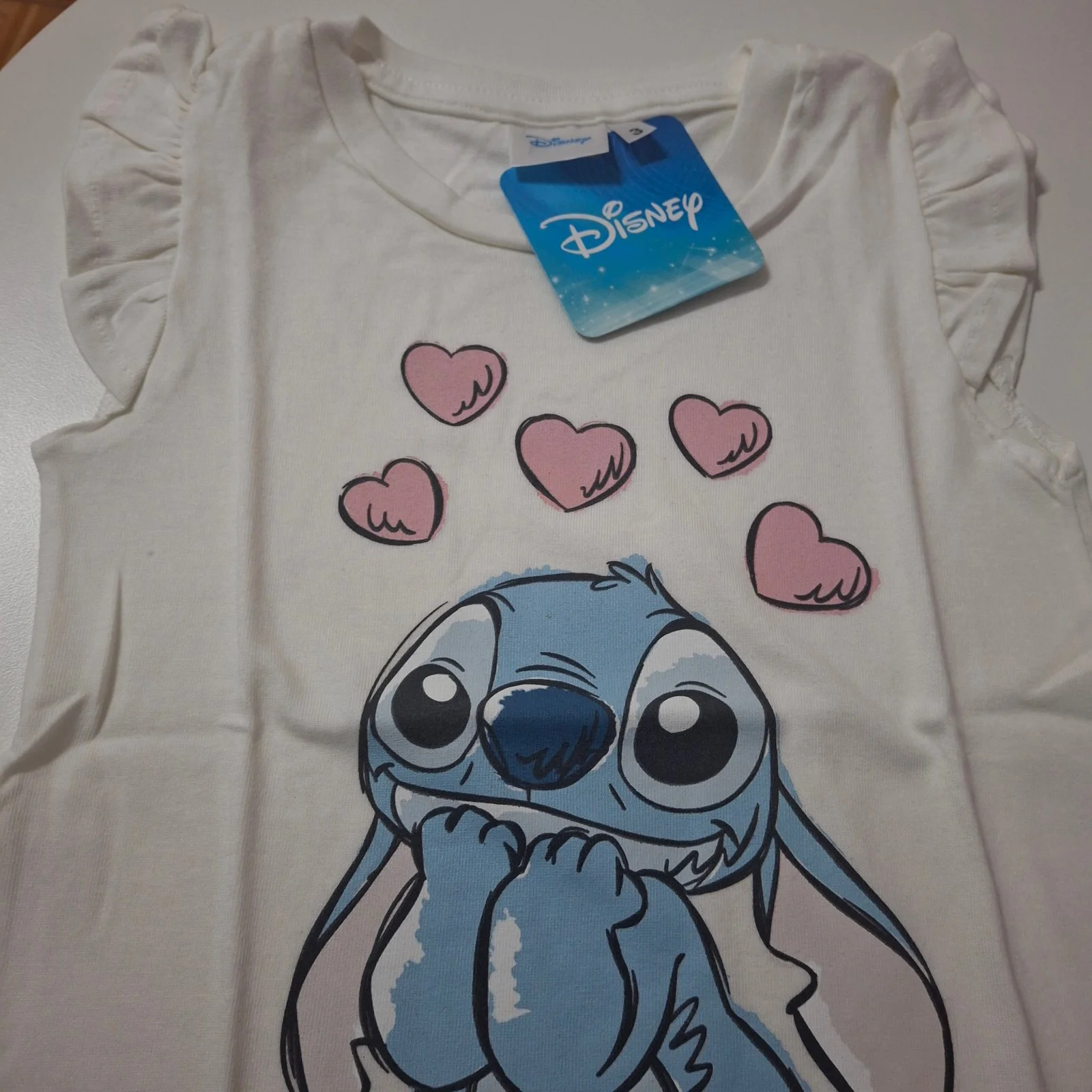 Remera de algodón Disney Stitch volados blanca